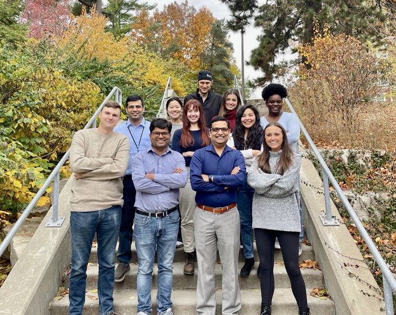 Dr. Mangalam's Lab Group standing on a staircase