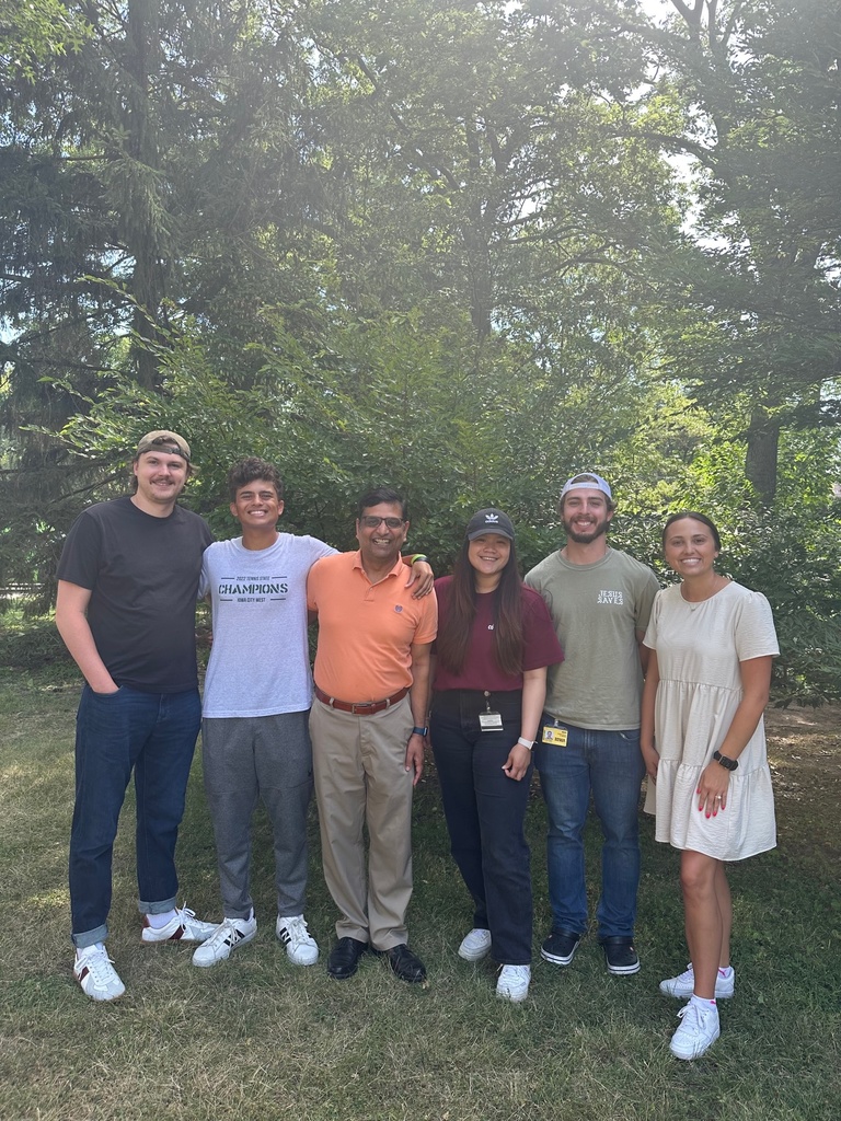 Dr. Mangalam and summer interns smiling outside