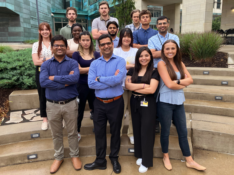 Mangalam Lab members posing and crossing their arms